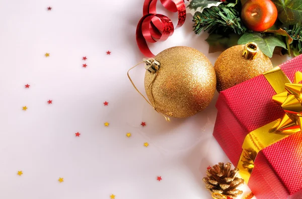 Christmas decoration with two golden balls and red gift