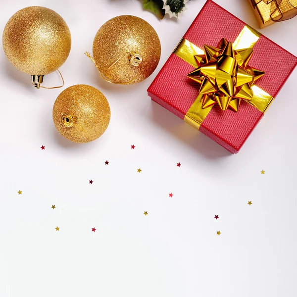 Gift and golden ball Christmas decoration isolated top view