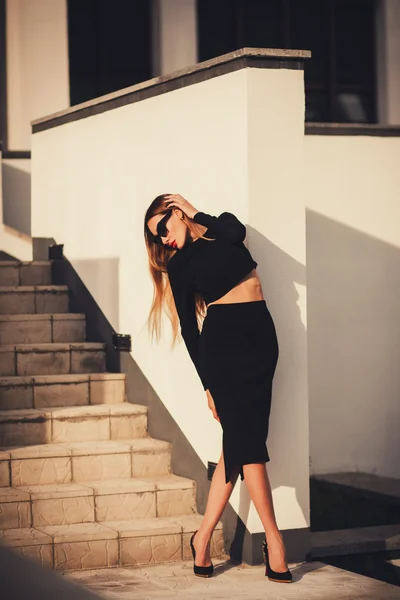 Trendy woman in a black skirt