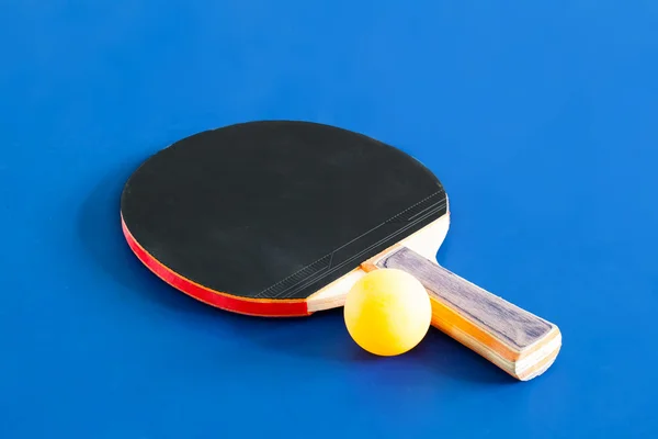 Table tennis and ball symbol laying on table