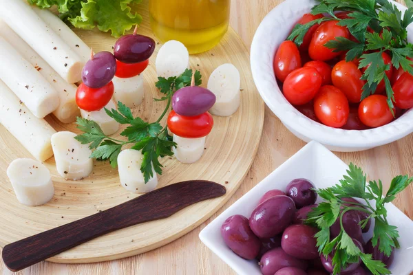 Canape of Heart of palm (palmito), cherry tomatos, olives