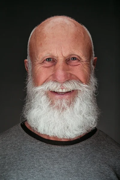 Old man with a long beard with big smile