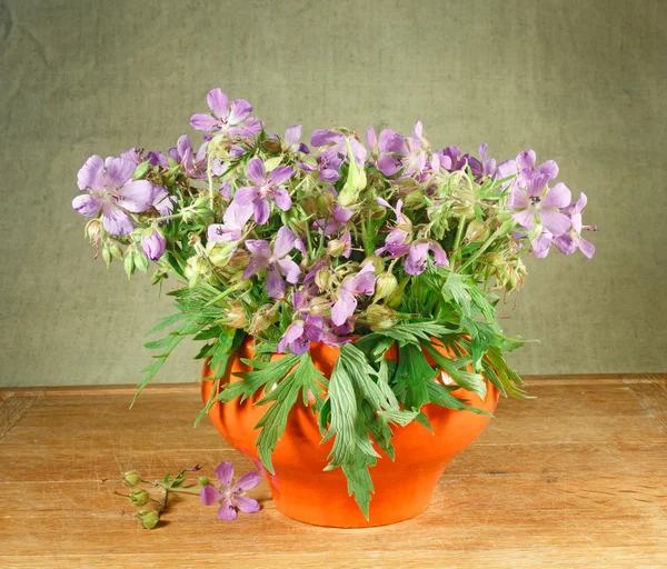Bouquet of meadow flowers on a wooden table