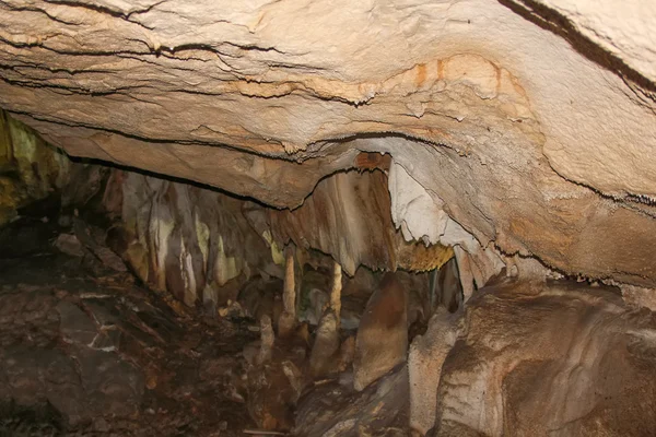 Underground cave with stalactites and stalagmites.