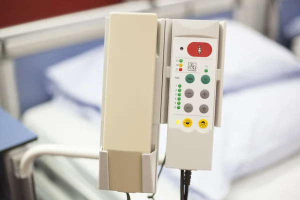 Device next to hospital bed to call the nurse