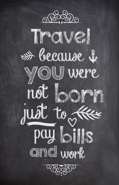 Travel Quote written with chalk on a black board