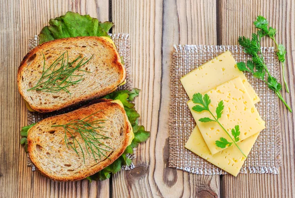 Toast with cheese and herbs. Bread with bran