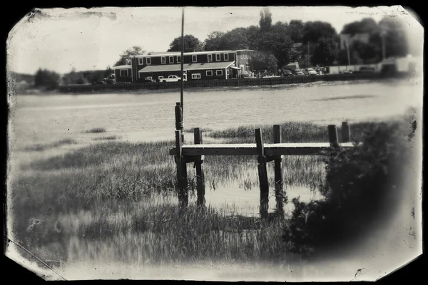 Wooden dock at Wellfleet, MA on Cape Cod in black and white