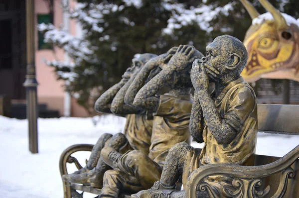 Gilded sculpture of three monkeys . I do not say , I do not see , can not hear