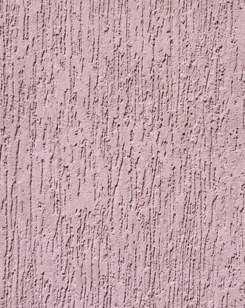 Violet relief plaster on wall closeup