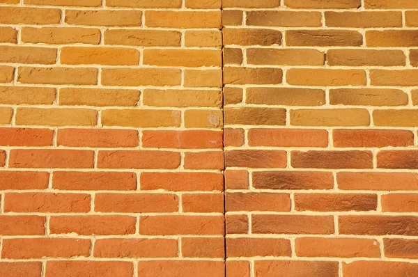 Wall with cladding tiles imitating bricks