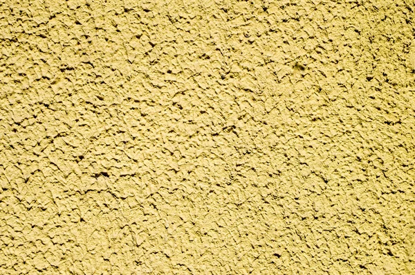 Decorative yellow relief plaster on wall