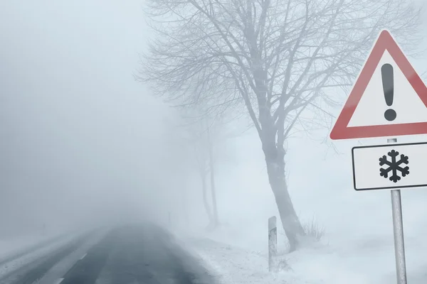Caution - Foggy Winter Road