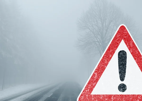 Caution - Foggy Winter Road
