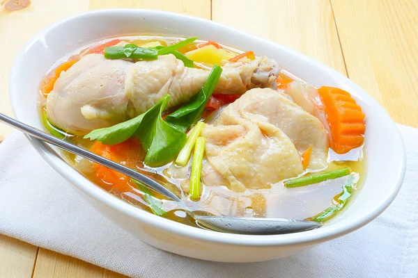 Chicken soup chicken soup with vegetables in a bowl