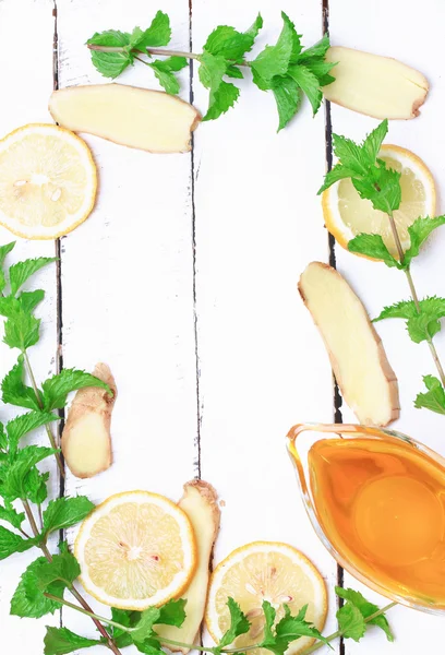 Ginger honey lemon mint on a white wooden background ingredient for homemade lemonade rustic style flat look view from above over head