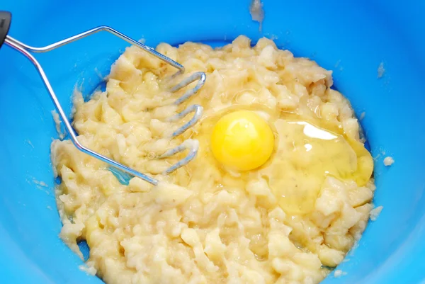 Mashed Bananas with a Raw Egg on Top