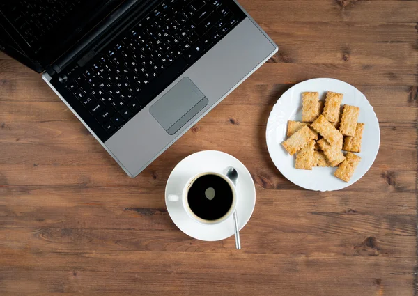 Laptop, coffee, and  plate of cookies