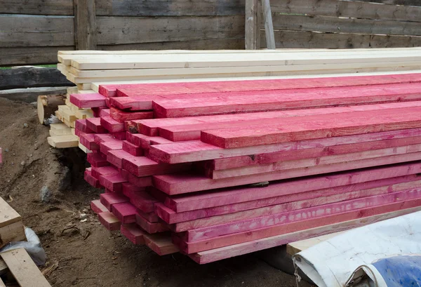 Stacked wood boards treated with antiseptic spray