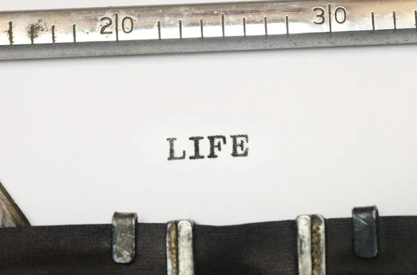 Word life typed on typewriter