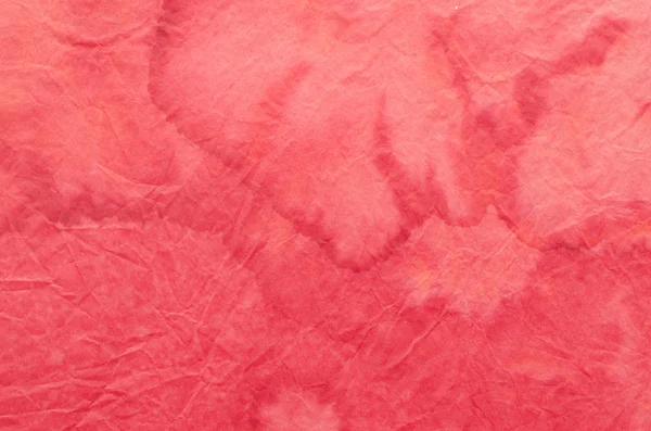 Red painted crepe paper background