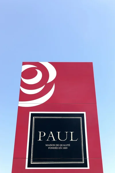 Paul logo on a wall