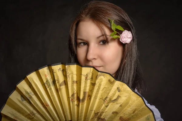 A woman folding fan