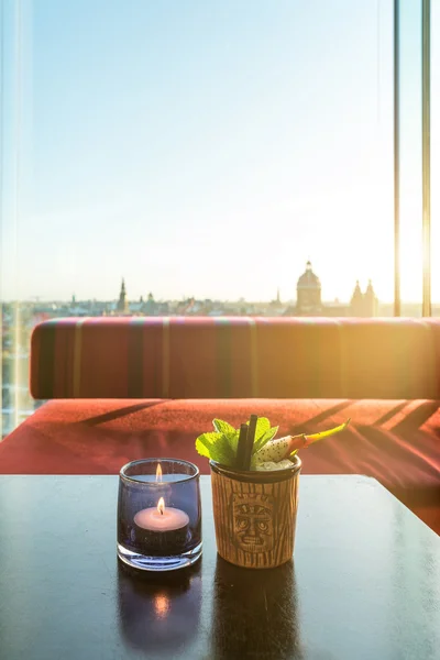 Tropical fruit dragon fruit  cocktail on table in rooftop bar in Amsterdam, Netherlands.