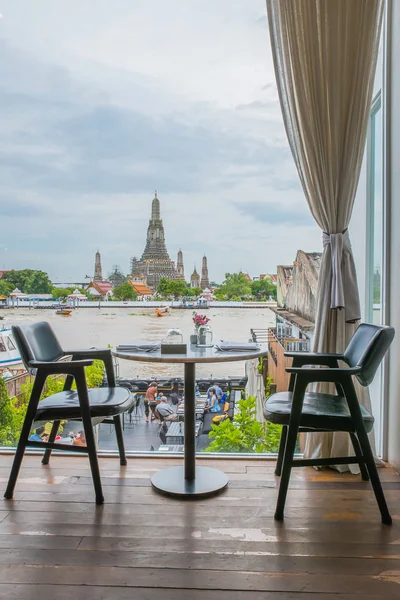 Riverside seats and tables near Chao phraya river in Bangkok, Th