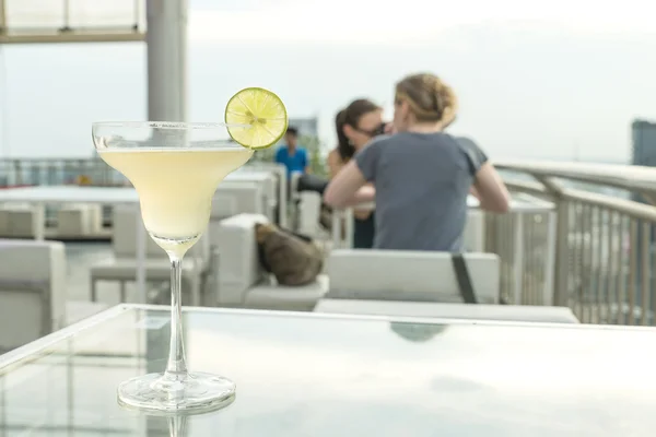 Margarita cocktail on table in rooftop bar