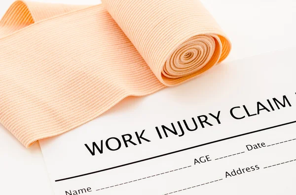 Work injury claim form showing business insurance concept.