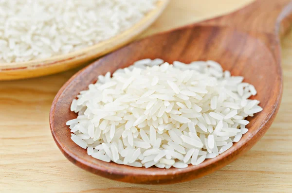 Raw rice on wooden.