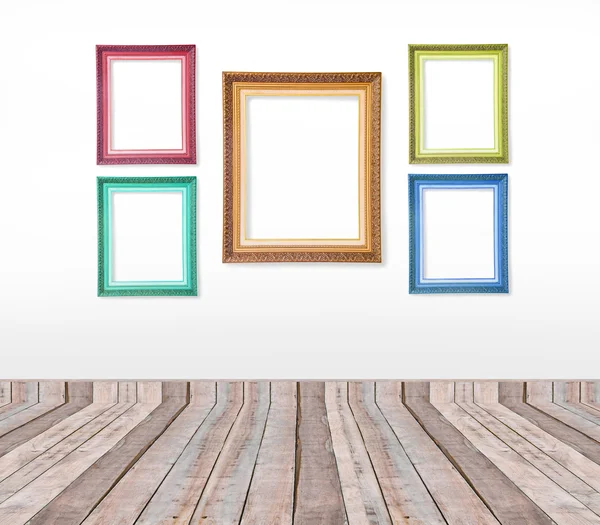 Set of color vintage picture frames on the wall