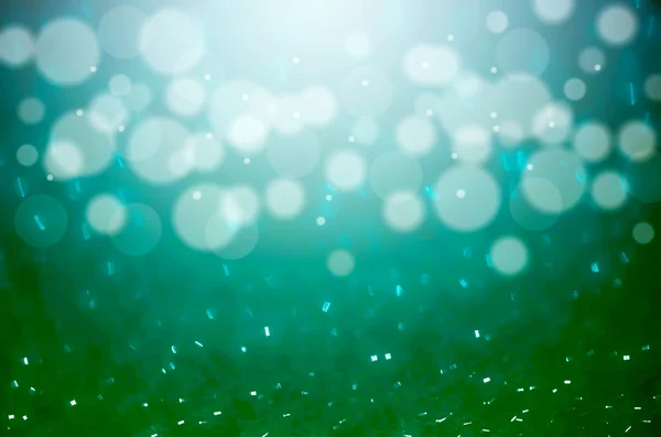 Abstract blurred photo of bokeh green and blue light burst and t