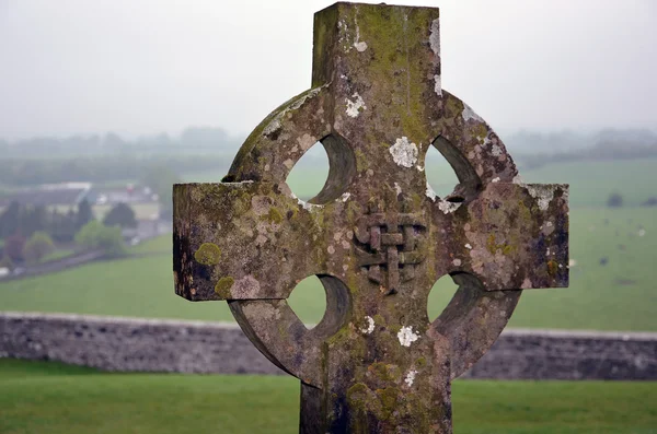 Celtic cross on the graveyard nature landscape