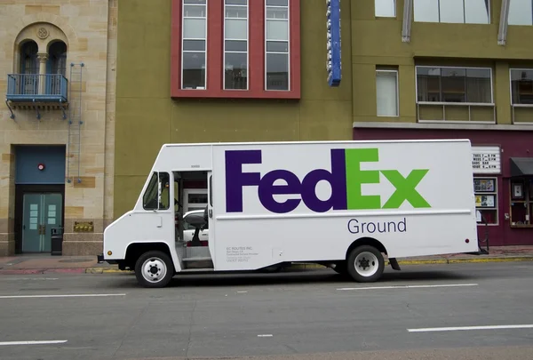SAN DIEGO, California, USA - March 14, 2016: FedEx truck delivers packages in San Diego, USA