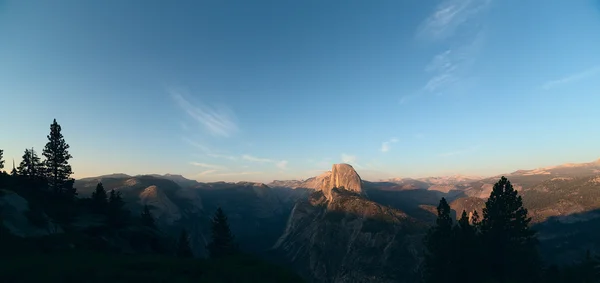Panoramic view on Half Dome peak in sunset light from Glacier Po