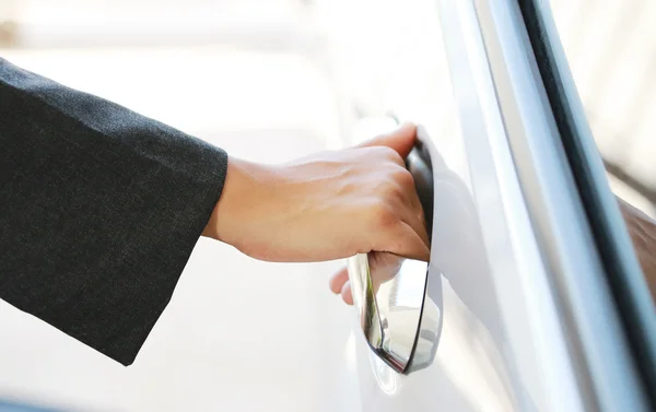 Hand business woman open car door