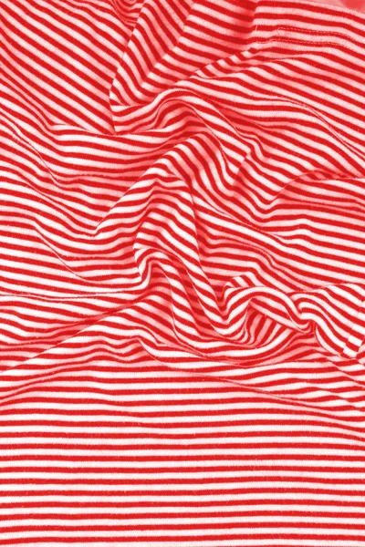 Striped wrinkled red and white zebra fabric cloth background