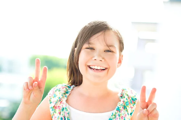 Cute girl is holding her face in astonishment