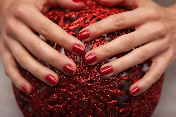 Beautiful woman\'s nails with beautiful christmas manicure