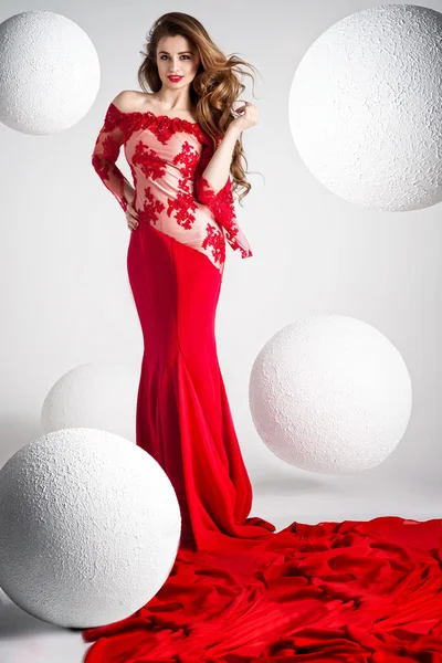 Elegant beautiful woman in red dress.