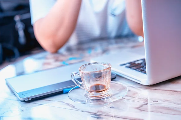 Graphic Designer drinking coffee during working