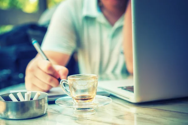 Graphic Designer drinking coffee during working