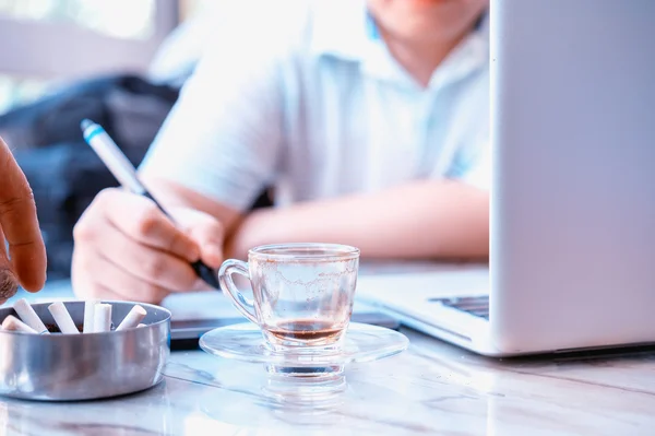 Graphic Designer drinking coffee during working