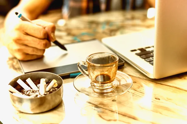 Graphic Designer drinking coffee during working