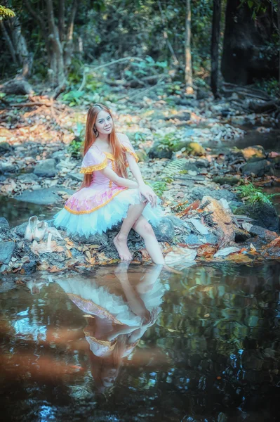 Asia beautiful girl in ballet dress on nature