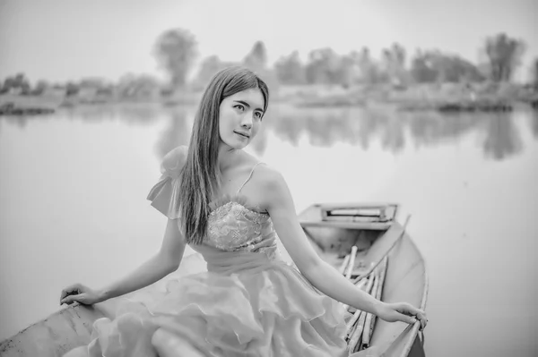 Asia Beautiful woman in yellow dress sit on boat
