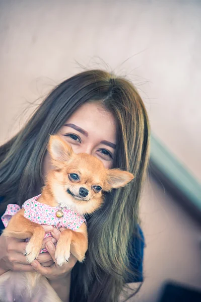 Happy young woman with dog