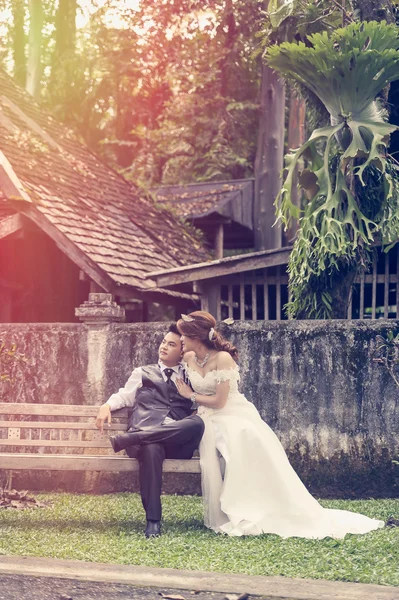 Asia young stylish fashion couple posing on nature.